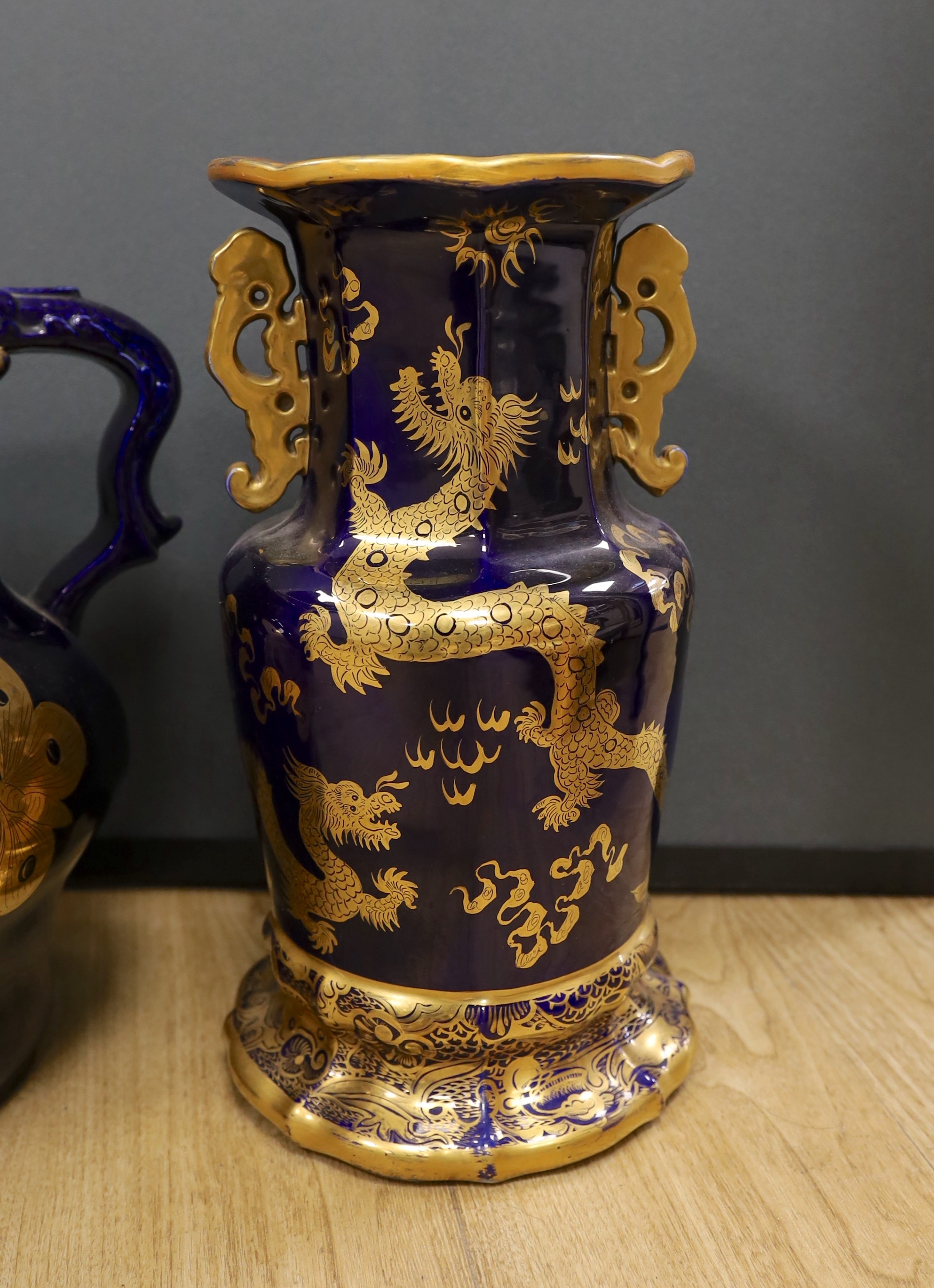 A large early 19th century Masons ironstone cobalt blue and gilt decorated jug and two similar large vases, tallest 37cms high